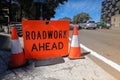 Road work ahead symbol sign applying on busy business center Royalty Free Stock Photo