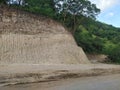 road work by eroding cliffs on the Trans Lembata road in the afternoon Royalty Free Stock Photo