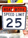 Road work and speed limit sign post Royalty Free Stock Photo