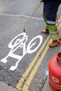 Road worker burning on a cycleway logo