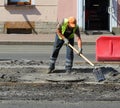 Road worker with shovel