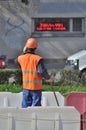 Road worker talking on the phone