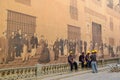 Road workers near the historical painted wall in Havana