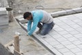 Road workers repair the sidewalk in Istanbul near the Galata Bridge