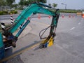 Road works building site excavator and worker