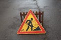 Road works sign for construction works in city street. Road under construction traffic sign. Warning sign road repairing. Royalty Free Stock Photo