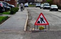 `Road works` sign in the middle of the street residential area