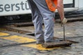 Roadman repairs streetcar rails Royalty Free Stock Photo