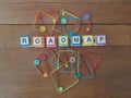 Roadmap in letters on wood background with colorful geometric shapes