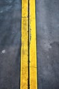 roadmark yellow line on asphalt top view Royalty Free Stock Photo