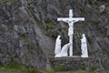 Roadside crucifix and holy statues Royalty Free Stock Photo
