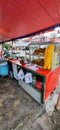 A roadside food stall that serves traditional Indonesian food, namely Nasi Uduk.