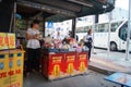 Roadside food stalls, the workers are eating snacks