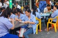 Roadside food stalls, the workers are eating snacks