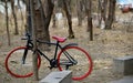 Roadside red wheel bike