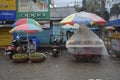 Roadside shopkeeper selling fruits during rainy season