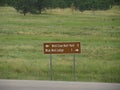 Roadside sign with directions to the Wind Cave National Park and Blue Bell Lodge at Custer State Park