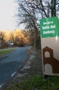 Roadside signpost for Route through El Valle Del Ambroz in autumn in vertical