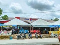 A roadside stall and a complex Padang Waremart near at the Thailand border in Perlis, Malaysia.