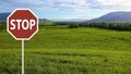 Roadside stop sign in outdoor country Royalty Free Stock Photo