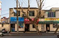 Roadside traditional stores selling mobile phones, wool products, foods on Wan`an Rd in Jiangwanzhen