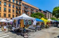 Vendors stalls with visitors at an outdoor fair festival in New York City USA