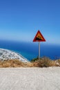 Roadsign - 10 percent rise of the road. Steep hill downwards. Royalty Free Stock Photo