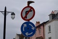 A roadsign on Sidmouth esplanade which shows a mini roundabout but with no right turn. This is because the high street is one way Royalty Free Stock Photo