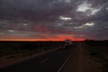 Roadtrain on stuart highway at night. A roadtrain use in remote areas of Australia to move freight efficiently, NORTHERN TERRITORY Royalty Free Stock Photo