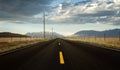 A roadway in a countryside with mountains