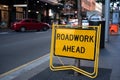 roadwork ahead sign located on street side Royalty Free Stock Photo