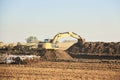 Roadwork, an excavator working on the construction of a road, a highway Royalty Free Stock Photo