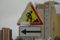 Roadwork road construction sign with snow on it Royalty Free Stock Photo