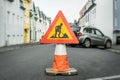 Roadwork sign on a cone