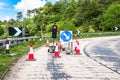 Roadworks area on wainding mountain road on a clear spring day Royalty Free Stock Photo