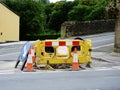 Roadworks with diversion sign and traffic cones red Royalty Free Stock Photo