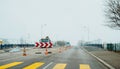 Roadworks in France with half road closed construction trucks