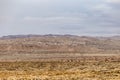 Roaming mountain landscape behind beautiful desert vista Royalty Free Stock Photo