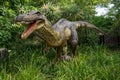 Roaring Baryonyx standing in tall grass display model in Perth Zoo as part of Zoorassic exhibition