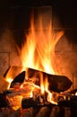 Roaring Fire in Fireplace with Logs and Flames