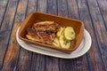 Roast beef brisket with baked potatoes in a clay pot Royalty Free Stock Photo