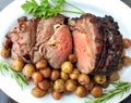 Roast beef dinner with roasted potatoes and herbs Royalty Free Stock Photo