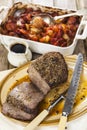 Roast beef joint with roast vegetables Royalty Free Stock Photo