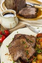 Roast beef joint with roast vegetables Royalty Free Stock Photo