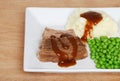 Roast beef mashed potatoes gravy and peas