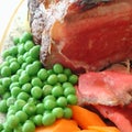 Roast beef, peas, carrot and potatoes Royalty Free Stock Photo