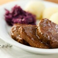 Roast beef with potato dumplings and red cabbage