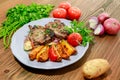 Roast beef rib eye flato with pita bread, tomato, potato veggies, onion and coriander served in dish isolated on table side view Royalty Free Stock Photo