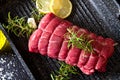 A roast of beef with rosemary on plate pot on black Royalty Free Stock Photo