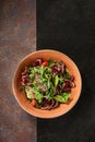 Roast beef salad with red onion, rustic lighting, overhead composition Royalty Free Stock Photo